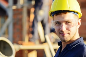 Male worker smiling at a field site