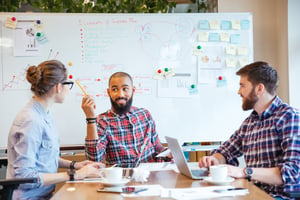 Group of people sitting in conference room and brainstorming on business meeting